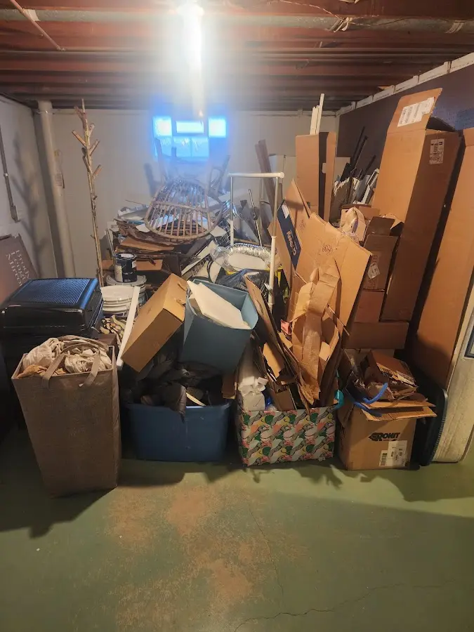 Roll-off dumpster container at job site for Construction Dumpster Rental in Brighton